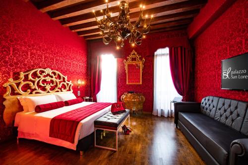 a red bedroom with a bed and a couch at Palazzo San Lorenzo in Venice