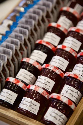 a bunch of bottles of honey on a shelf at The Z Hotel Covent Garden in London