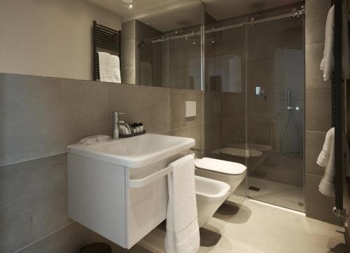 a bathroom with a sink and a toilet and a shower at Pergola35 in Florence