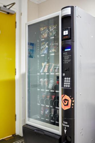 a vending machine with drinks inside of it at St Christopher's Inn Hammersmith in London