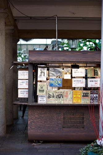 a book stand with lots of books on it at The Z Hotel Covent Garden in London