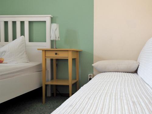 Letto o letti in una camera di Landgasthof Zum Schwarzen Grat
