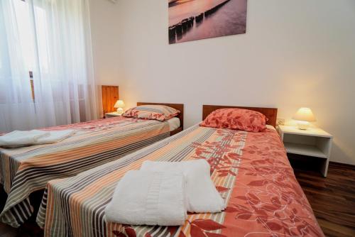 Posteľ alebo postele v izbe v ubytovaní Apartment Cici