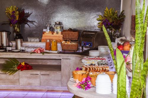 a kitchen with a table with food on it at Easter Island Ecolodge in Hanga Roa