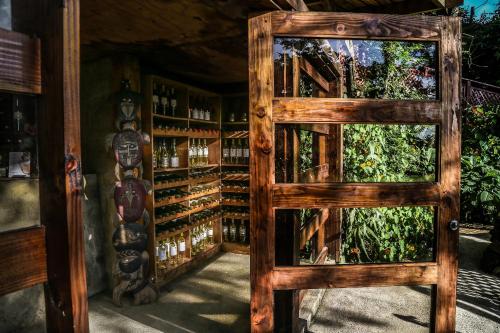 a wooden door leading into a wine cellar at Easter Island Ecolodge in Hanga Roa