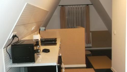 a room with a box with a computer in it at Apartamenty Lejówka in Chochołów
