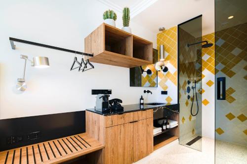a kitchen with a wooden counter and a sink at The Highlander Amsterdam in Amsterdam