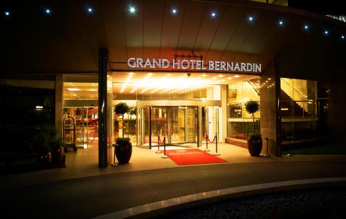a grand hotel with a sign that reads grand hotel berkeley at Grand Hotel Bernardin in Portorož
