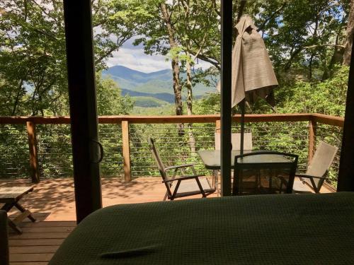 a view of a porch with a table and chairs at Barefoot Hills in Dahlonega