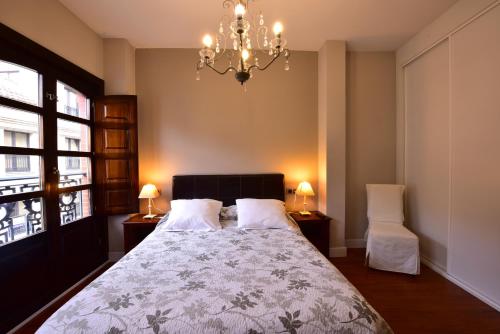 Кровать или кровати в номере Salamanca Centro Apartamentos