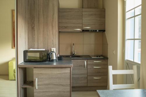 A kitchen or kitchenette at Nidos stiegė