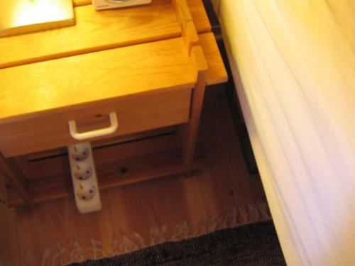 a wooden dresser with a drawer in a room at Your cabin in Trondheim in Tiller