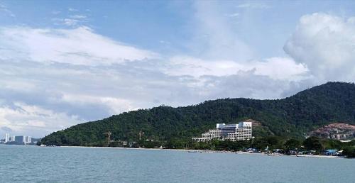 a view of a resort from the water at M's Place Chalet Bed&Breakfast in George Town