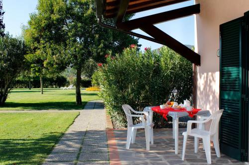 a table and chairs sitting on a patio at Agriturismo Bocci in Castiglione della Pescaia