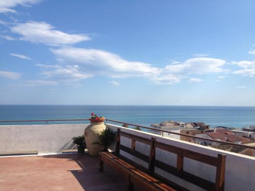 a balcony with a view of the ocean at Hotel Mediterraneo in Roccella Ionica