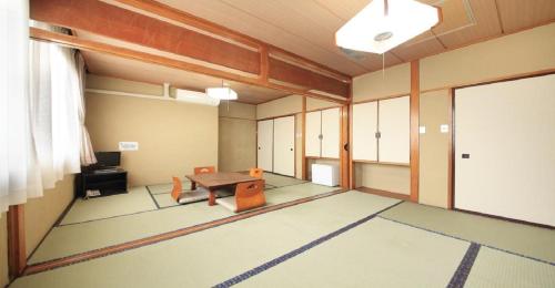 an empty room with a table and chairs in it at Yu-topia / Vacation STAY 8765 in Kai