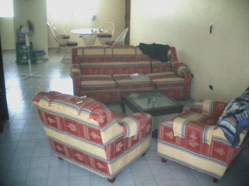 a living room with two couches and a coffee table at Dre Broeders Apartments Juan Dolio in Juan Dolio