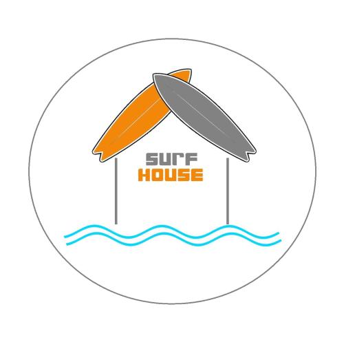 a surf house with a surfboard in the water at The SURF hOuSe @ Keros Beach , Kalliopi in Kalliópi