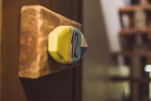 a close up of a yellow object on a door at Pousada Pé na Areia in Garopaba