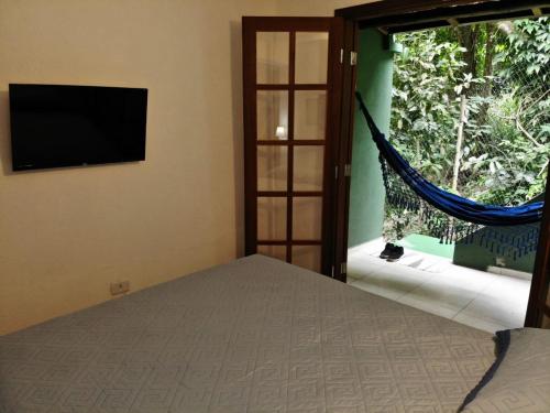 Кровать или кровати в номере SOL&MAR Suítes Ilhabela