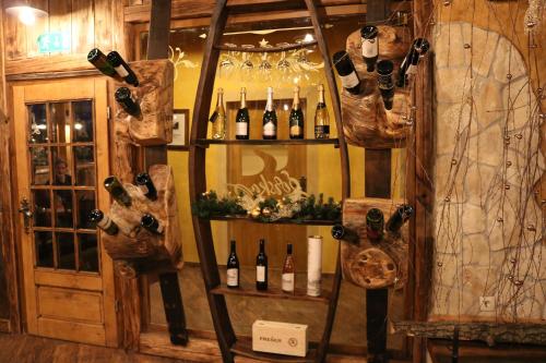 a room with a bunch of bottles of wine at Gorska Reka Guesthouse in Zreče