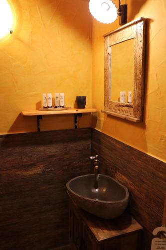 a bathroom with a sink and a mirror at Gorska Reka Guesthouse in Zreče