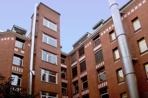a brick building with a pole in front of it at acama Hotel & Hostel Kreuzberg in Berlin