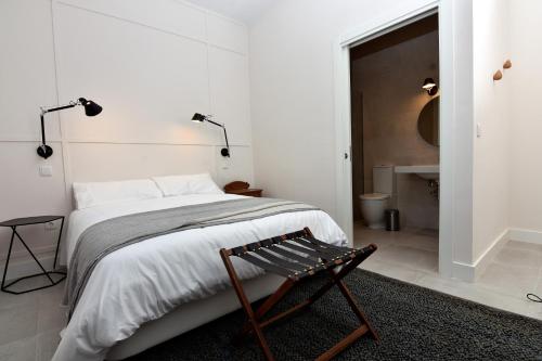 Katil atau katil-katil dalam bilik di SANMARTINA HOTEL