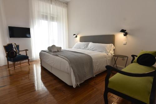 Katil atau katil-katil dalam bilik di SANMARTINA HOTEL