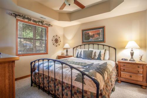 a bedroom with a bed and a window at The Village At Indian Point Resort in Branson