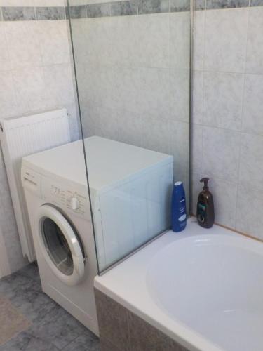 a washer and dryer in a bathroom at *OI.KO HOUSE* City Apartments in Kato Achaia