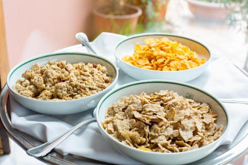 three bowls of food sitting on a tray at Country Hotel & Resort I Calanchi in Ripatransone