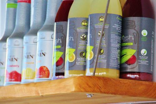 a row of books sitting on a wooden shelf at Ifestos Villa in Fira