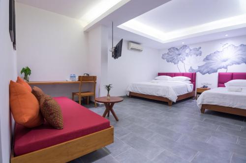Un ou plusieurs lits dans un hébergement de l'établissement Neth Socheata Hotel