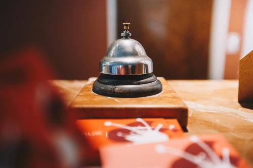 a small bell sitting on top of a table at Hosteria Los Tilos in Villa Carlos Paz