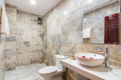 a bathroom with a sink and a toilet at Horizon 2 villa in Hoi An