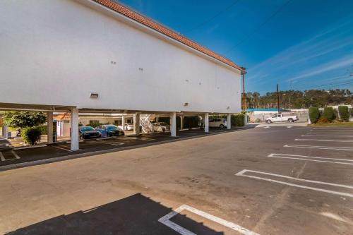 an empty parking lot in front of a building at Motel 6 Monterey Park in Monterey Park