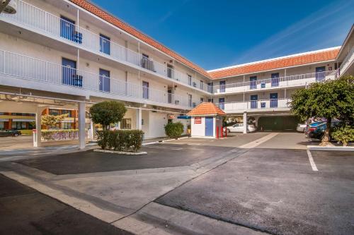 an empty parking lot in front of a building at Motel 6 Monterey Park in Monterey Park