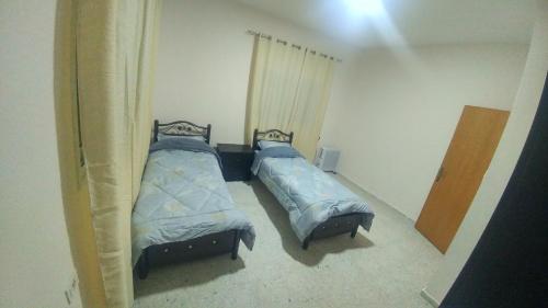 מיטה או מיטות בחדר ב-Barmil Residence