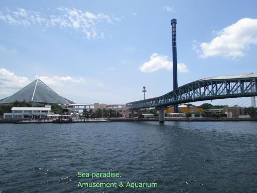 a bridge over a body of water with buildings at ゲストハウス杉田 古民家貸切の完全プライベート空間 杉田駅徒歩2分 セルフチェックイン in Yokohama