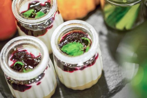 three desserts in glass jars on a table at Radisson Hotel Papirfabrikken Silkeborg in Silkeborg