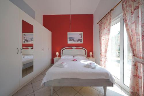 Ένα ή περισσότερα κρεβάτια σε δωμάτιο στο Secret Paradise Villas