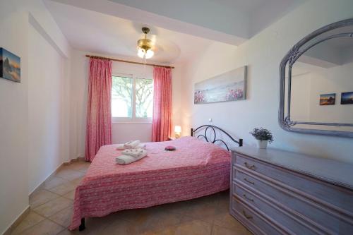 Posteľ alebo postele v izbe v ubytovaní Secret Paradise Villas