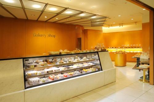 a bakery shop with a display case of food at JR Hotel Clement Takamatsu in Takamatsu