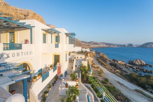 a view of the ocean from the balcony of a hotel at Arhontiko Hotel in Foinikion