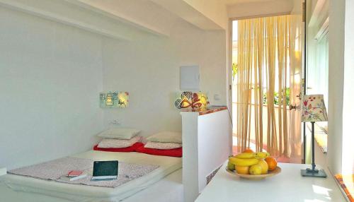 Posteľ alebo postele v izbe v ubytovaní Splendido studio, vista mare, a 5mn dalla spiaggia - Casa ArteVida