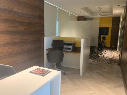 an office with a desk with a computer on it at Country Inn & Suites by Radisson Chandigarh Zirakpur in Chandīgarh