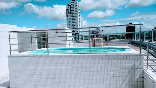 a swimming pool on the roof of a building at Carlos Roberto Da Costa in Nossa Senhora do Livramento