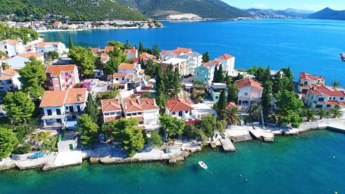 an aerial view of a town on the water at Apartments Mediterranean House in Klek