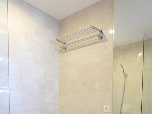 a shower in a bathroom with a glass shower stall at Luxury 2 BR Suite at The Grove-Masterpiece, Epicentrum in Jakarta